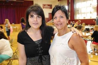 Paraprofessionals Lisa Laico and Connie Regeiro before the meeting.