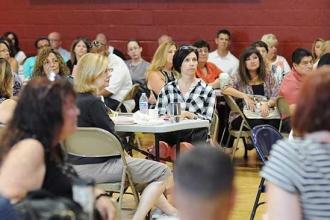Members listen to Mulgrew’s message.