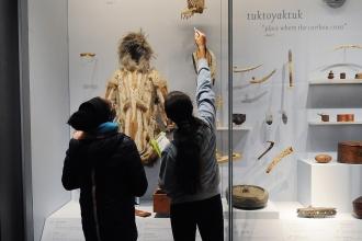Eighth-graders at MS 447 study Native artifacts at the Museum of the American Indian.