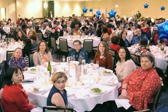 Nearly 1,000 pack the grand ballroom at the Hilton for the event.