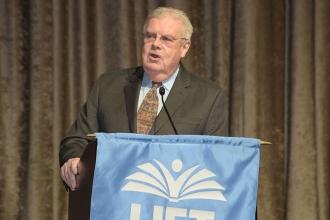 Retired Teachers Chapter Leader Tom Murphy addresses the group.
