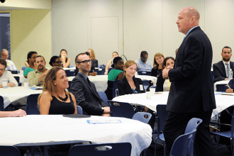 UFT President Michael Mulgrew addresses new teachers during the plenary.