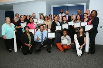 Bronx award recipients pose with their certificates and Ruben Diaz Jr.