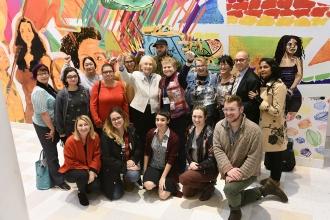 Art teachers enthusiastically await the start of the awards ceremony