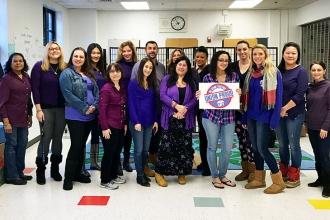 Educators wear purple at PS 139 in Queens to support paid parental leave.