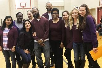 Staff members at the John F. Kennedy Jr. School in Queens wear purple in support