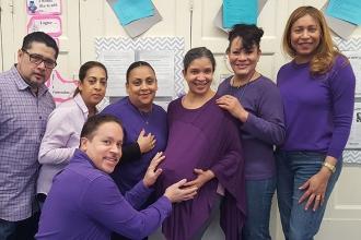 Educators at PS 115 in Manhattan show their support for paid parental leave.