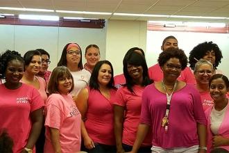 Staff members at P352@424 in the Bronx gather in pink.