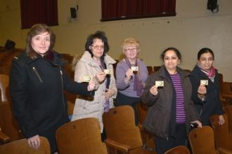 Displaying “I Vote” buttons (from left) are Helen Talamo, Mary Ann Greer, Pat Br