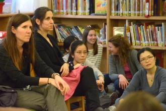 Staff and Joanie Terrizzi, listen to Mulgrew’s presentation.