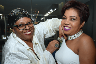 Majorie Carter pins a corsage onSarah O’Shaugnessy.
