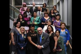 The honorees pose for a group photo behind Chapter Chair Tammie Miller.