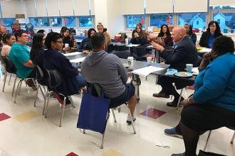 Mulgrew addresses the group.