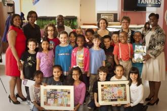 The students show off their artwork,