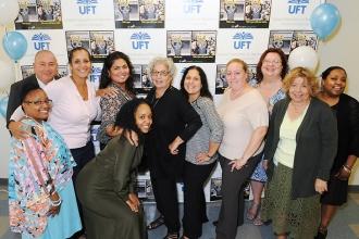 The Queens UFT staff celebrates a successful event.
