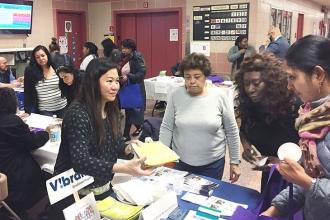 Parents browse exhibitor tables during a break between workshops.