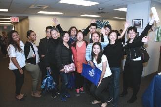 Parents and coordinators of PS 24 take a group shot. 