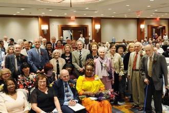 Retirees boasting 50- and 60-year UFT membership rise to be recognized.
