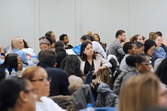 Crowd of people sitting and listening