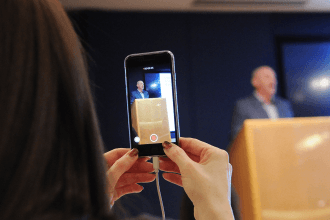 Woman records man using her smart phone