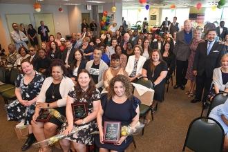 Group of people in a room seated