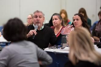 Middle age man speaks