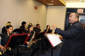 Music teacher Steven Oquendo directs the Columbus Campus Jazz Band during the co