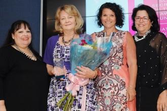 Kathryn Goffredo (second from left) of IS 27, Staten Island, is cheered by (from