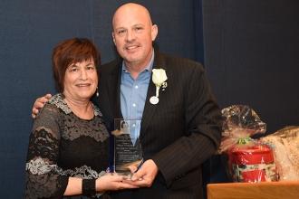 UFT President Michael Mulgrew presents the Celebration of Life Award to Mona Gon