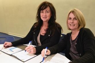 Kathy Carioti (left) and Tina O’Connor from Telecommunication Arts Tech HS in Br