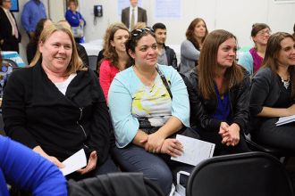 New members listen attentively.