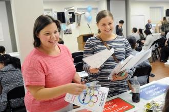 PS 55 teachers Kimberly Amatrudo (left) and Allyssa Giunta stop at the elementar