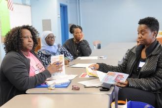 Four women sitting at a table