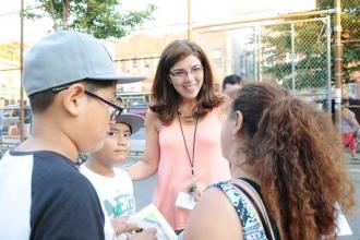 Guidance counselor Laura Jett gives out information to parents. 