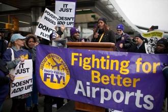 Airport workers kick off the 2013 holiday travel seasons on Nov. 12 with a rally