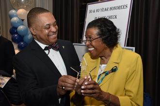 Florence King and her son, Gary King, share a smile over the award she received 