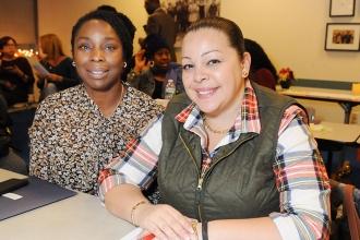Monika Cummings (left) and Neysa Torres await the start of the meeting.