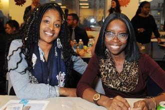 Safiya Francis (left) and Ramatu Kallon look over information.