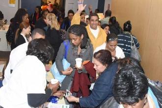 Parent Monique Andersongathers a brochure in between sessions.