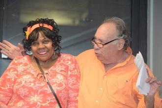 Cliff Ross wins a big smile from Marjorie Bryant.