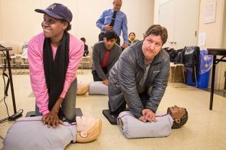 Parents Ella Felix (left) and Chad Vetsch attend a workshop to learn CPR.