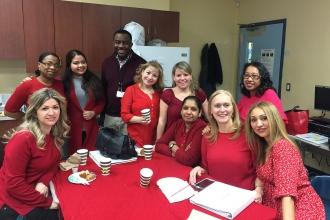 Educators in red at P 721 at Infotech in Queens.