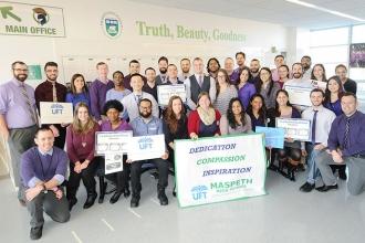 Maspeth HS members display their purple power.