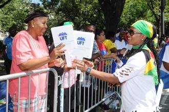 Donna Richards of PS 92 in Brooklyn distributed UFT fans.