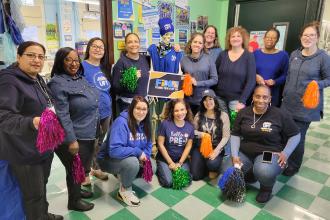 Members at PS 117 in Queens take a photo during the UFT's Fix Tier 6 Day of Action. 