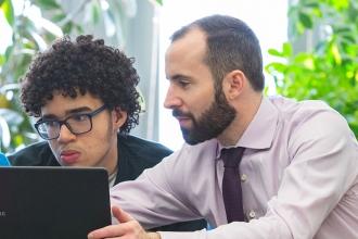 A teacher helps students 