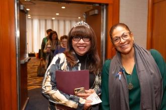 Two women smile for a photo