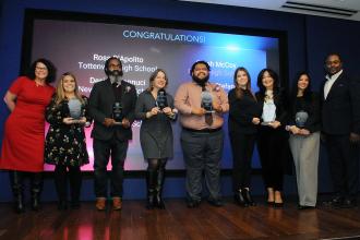 Six Staten Island CTE teachers hoist their awards during the UFT CTE Awards on Feb. 12, 2026