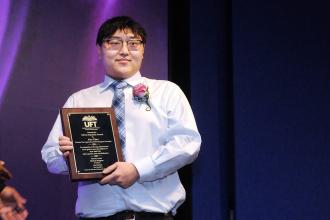 Alex Chen, who teaches electrical installation at Manhattan’s Coop Tech, wins the Edwin Espaillat Award, which is given to an educator enrolled in the Success Via Apprenticeship program during the 2026 UFT CTE Awards.