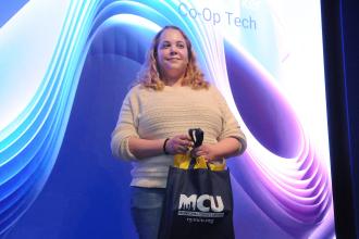 Electrician turned teacher Laurel Parker, accepts a Municipal Credit Union award at the UFT CTE Awards on Feb. 12, 2026. 